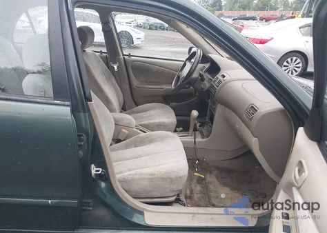 2000 Toyota Corolla Le from USA, damaged, VIN 2T1BR12E2YC309516